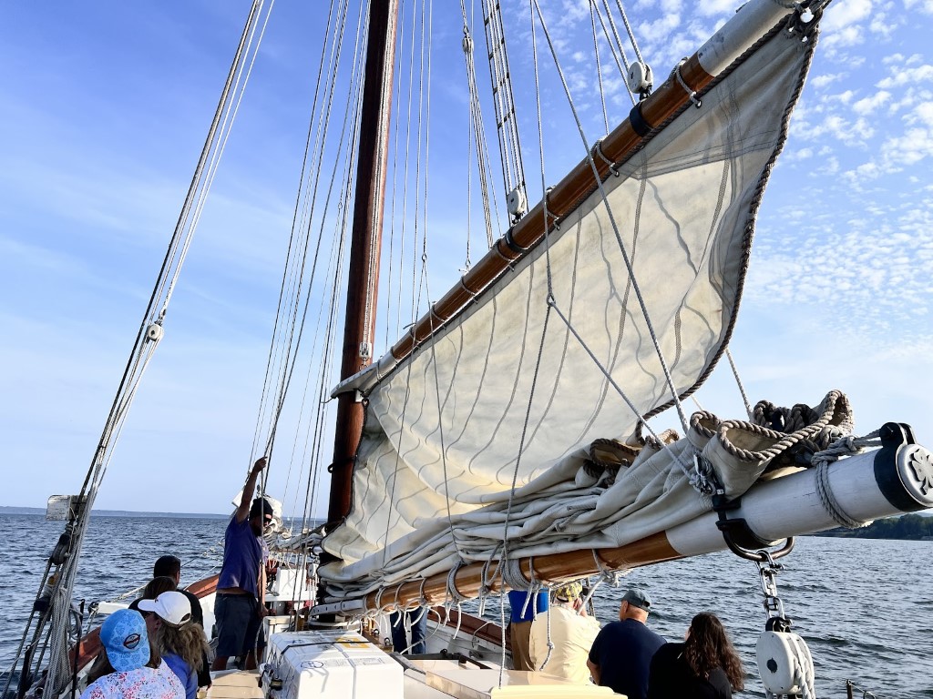 The Schooner's sails being hoisted